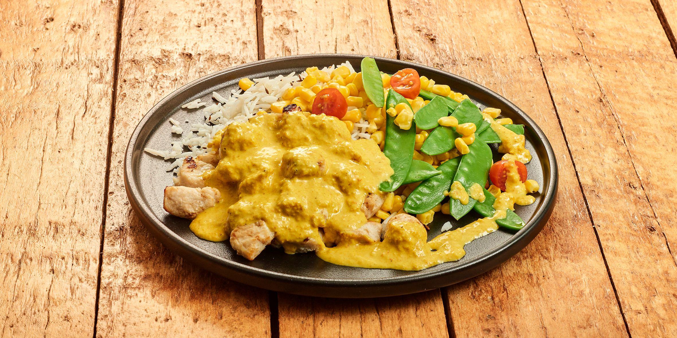 Gele curry met kip, groenten en zilvervlies-komijnrijst