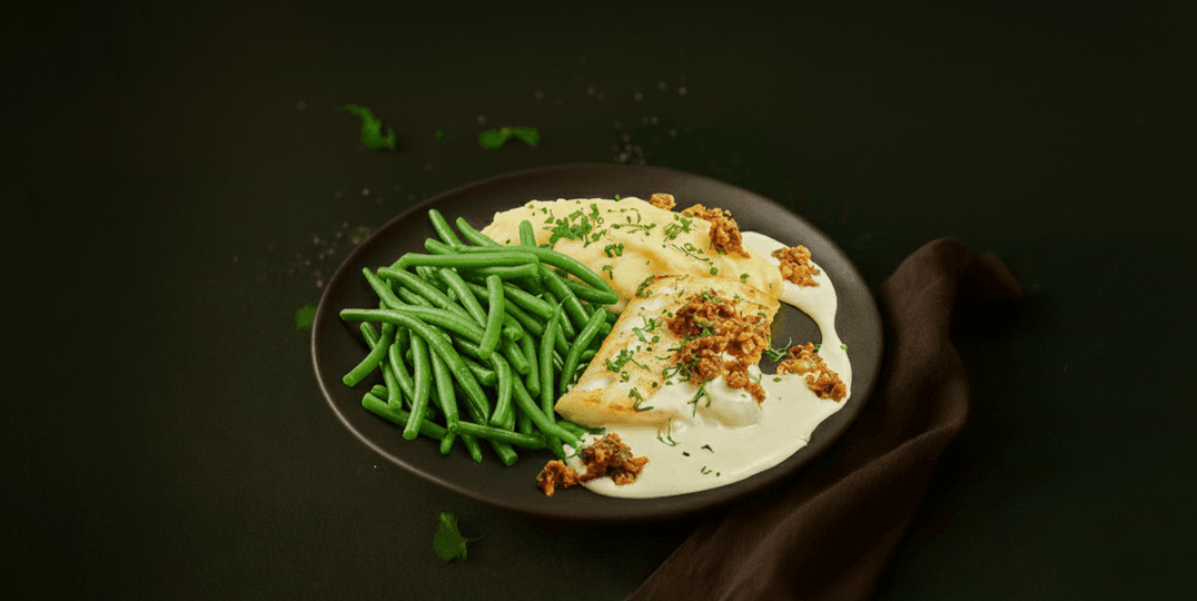 Heek in mascarponesaus met bonen en aardappelpuree