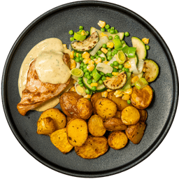 Kipfilet in honing-mosterdsaus met lentegroenten en krieltjes