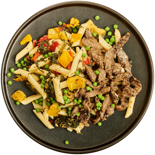 Pasta primavera met biefstukreepjes en groenten