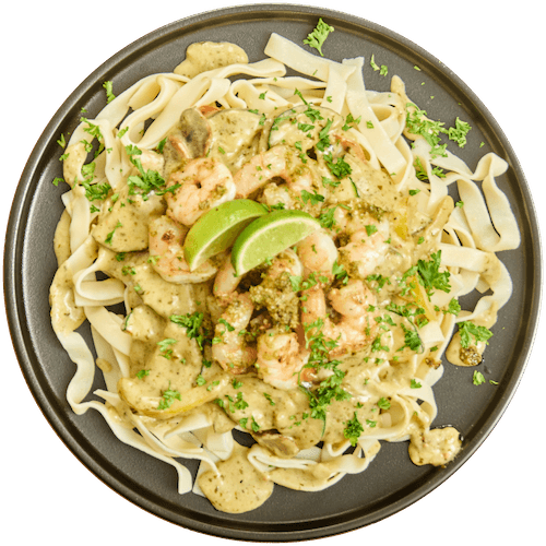 Tagliatelle met gamba’s en groenten in pesto