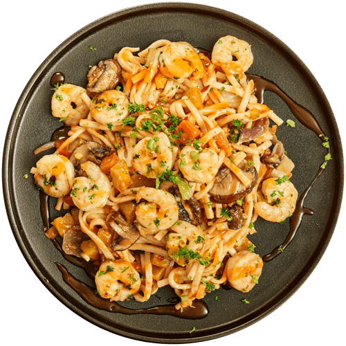 Noedels met groenten en gamba’s in zoetzure saus