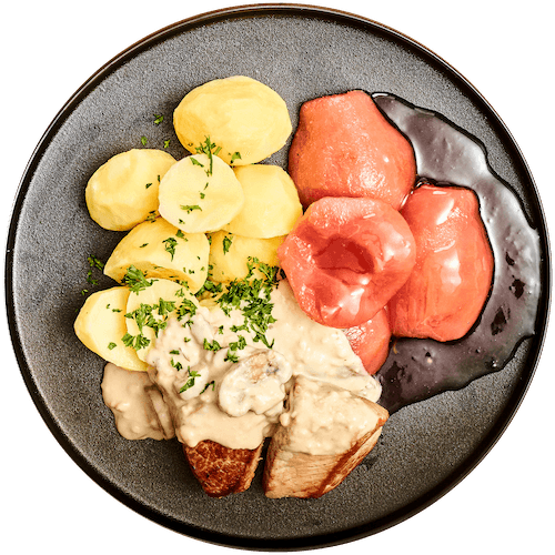 Varkenshaas in champignonsaus met stoofpeertjes
