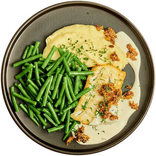 Heek in mascarponesaus met bonen en aardappelpuree